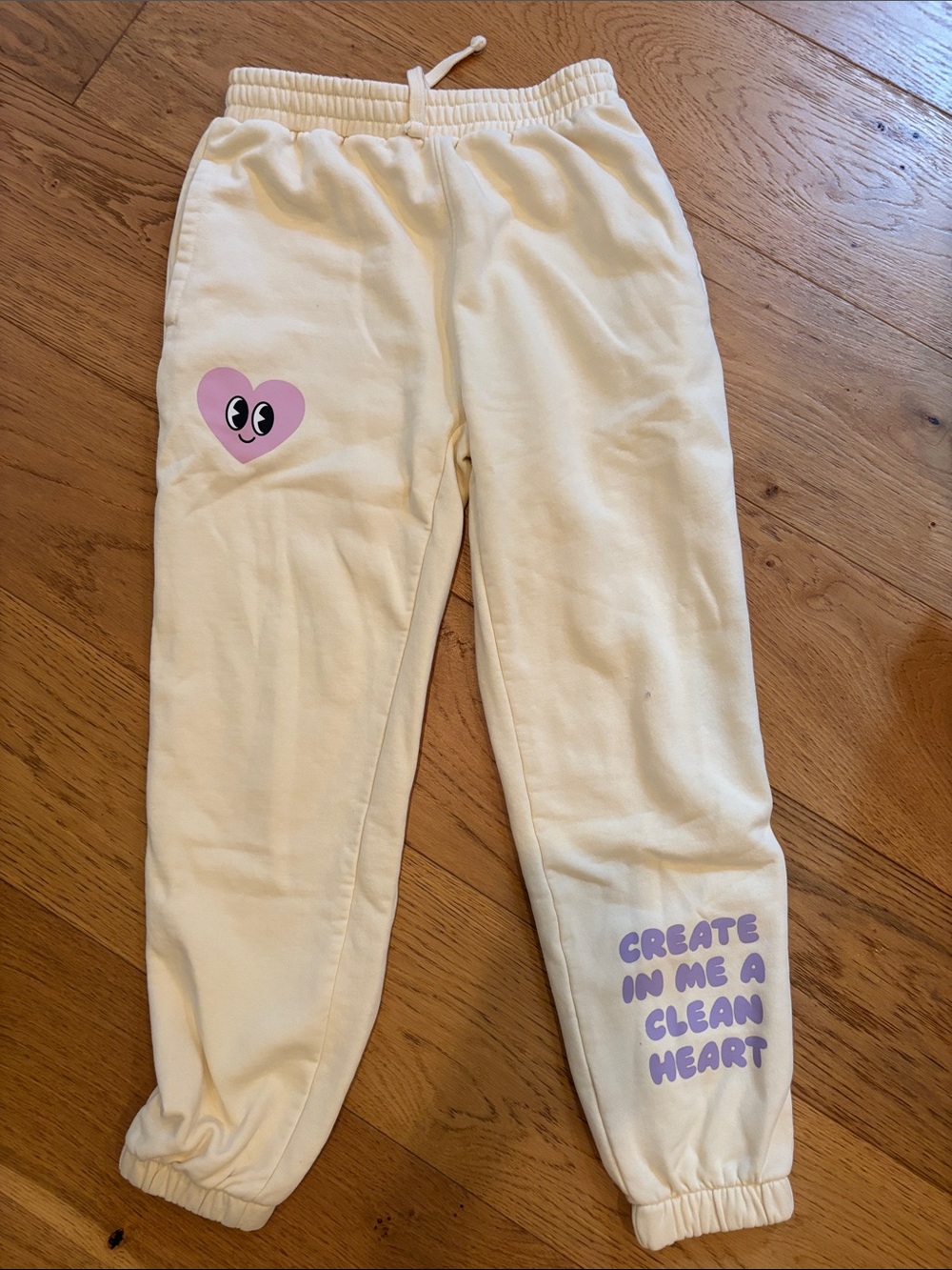 Kids Cream Sweatpants with Purple Heart Graphic and Text